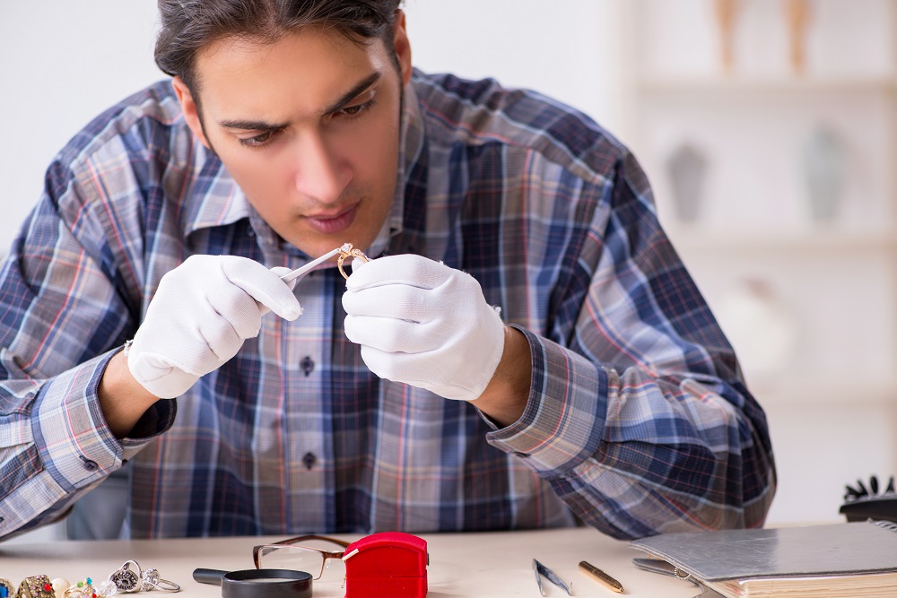 Jeweler examining ring